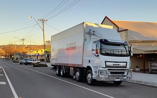 Moving Truck In Rural Town — Removalists in Bathurst, NSW