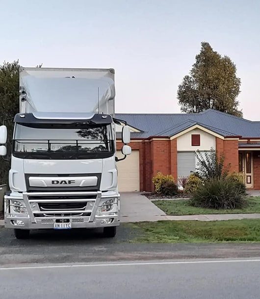 Moving Truck In Driveway — Removalists in Orange, NSW