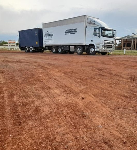 Moving Truck On Dirt Road — Removalists in Mudgee, NT
